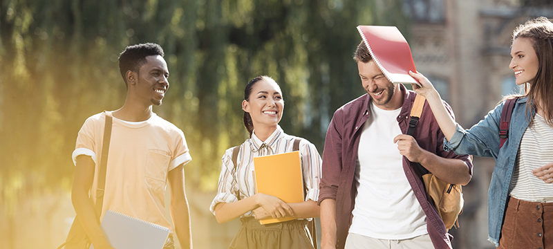 Students chatting outside a university